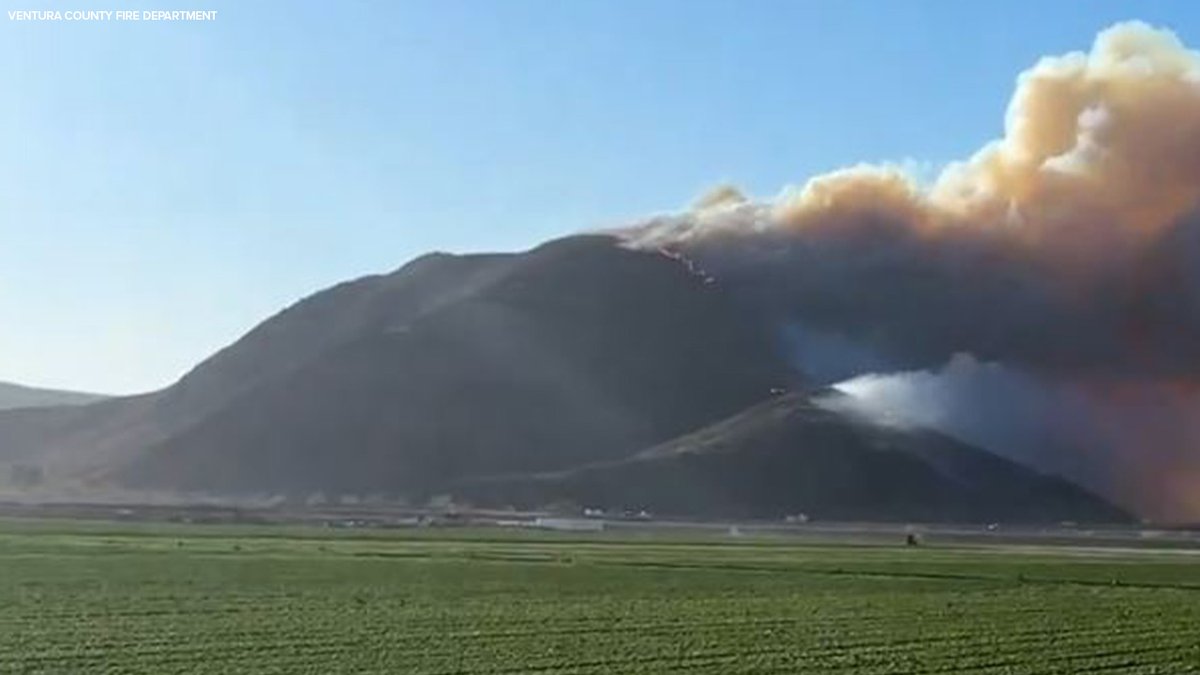 Firefighters race to battle fast-moving brush fire in Ventura County.