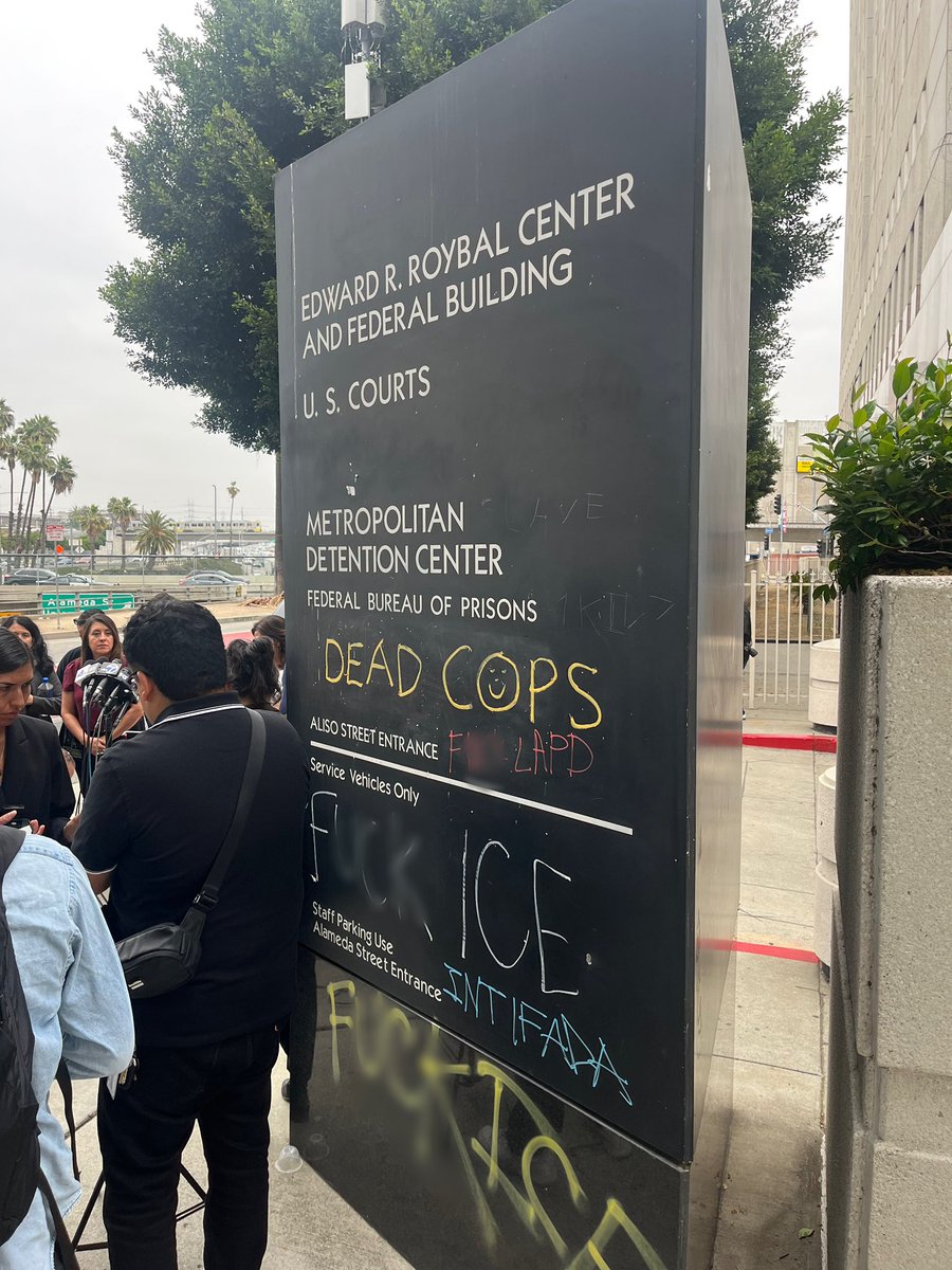 Vandalism outside the Federal Detention Center in downtown Los Angeles.  Much of the graffiti is anti ICE, police, and @elonmusk