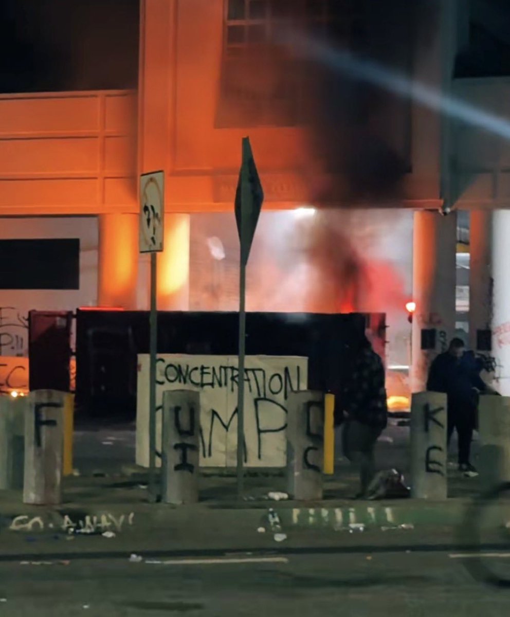 The Rioters in DTLA have set a large dumpster on fire in front of the Federal Detention Center in an apparent attempt to set the building on fire.  Rioters are also now blocking LAFD from getting  to the blaze