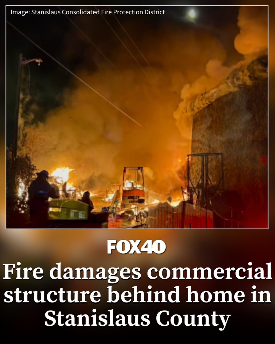 Firefighters battled a large blaze early Wednesday that damaged a commercial structure located behind a residential property