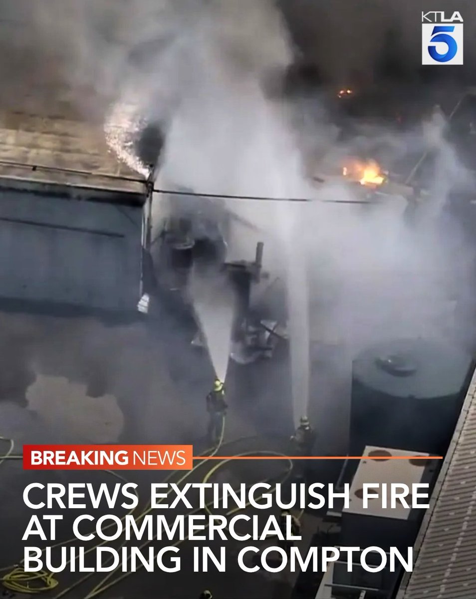Fire crews battled and extinguished a large commercial fire in Compton on Tuesday morning