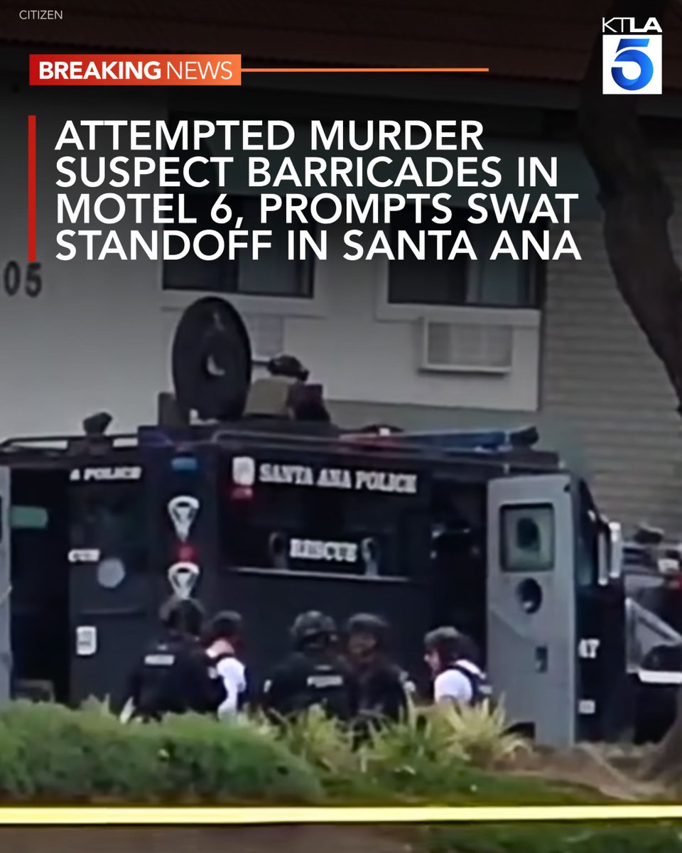 A wanted murder suspect has barricaded himself inside a Santa Ana motel room, prompting a large police response and road closures Sunday morning, authorities said