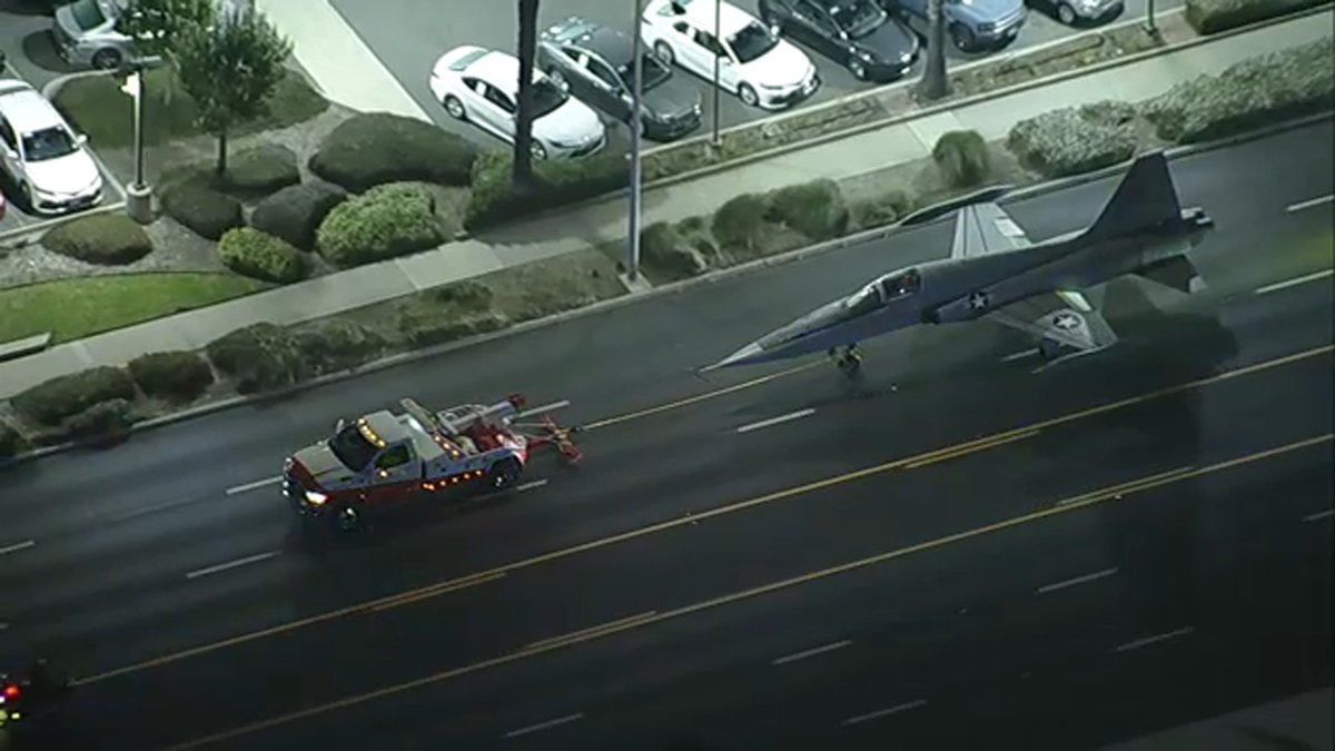 A military aircraft was given a police escort as it was towed from Torrance Airport