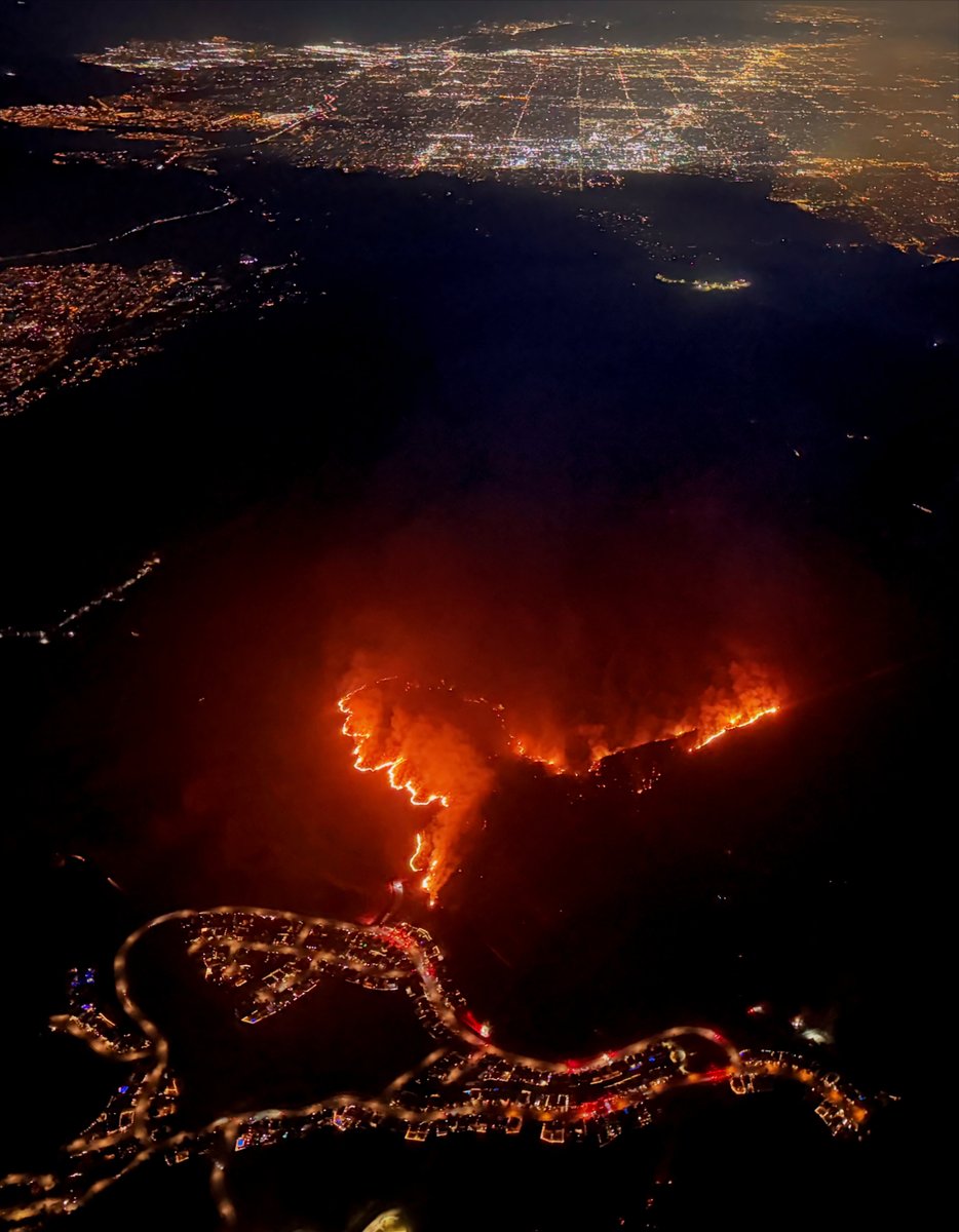 In Simi Valley, Runkle Canyon is ablaze tonight as fire crews work to protect White Bark Lane from the SandyFire